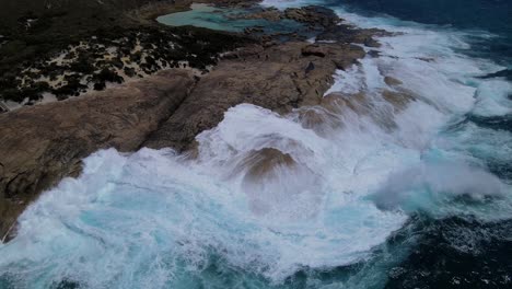 Waves-breaking-on-rocks-at-two-peoples-bay,-Albany-Western-Australia