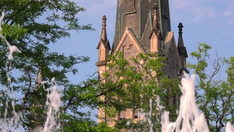 Church-steeple-with-fountain-in-foreground