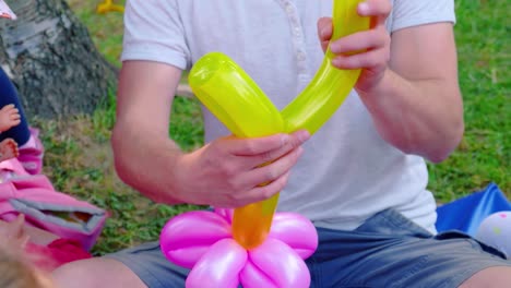colorful-celebration-of-a-man-making-balloons-for-the-children's-birthday