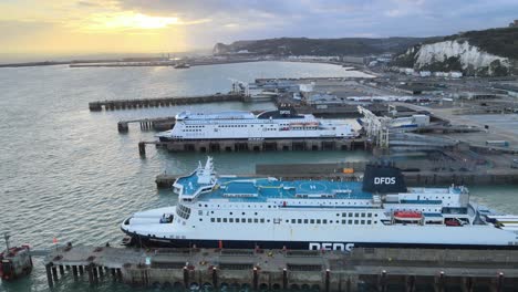 Sun-setting-DFDS-ferry-docked-Port-of-Dover-,Ferry-terminal-Kent-England-,aerial-4k-footage