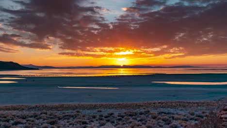 The-sun-sets-beyond-the-shore-of-Antelope-Island-in-Central-Utah---panning-time-lapse-of-the-Great-Salt-Lake