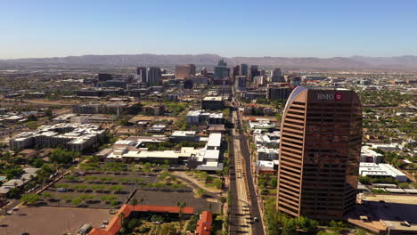 Aerial-flying-forward-over-downtown-Phoenix,-Arizona,-on-sunny-day