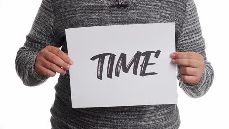 A-person-holding-a-sign-with-the-message-and-the-word-"time