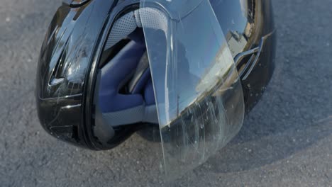 Close-Up-Pan-Right-of-a-Damaged-Motorcycle-Helmet