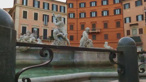 Low-angle-pov-around-Neptune-fountain-at-Piazza-Navona-in-Rome
