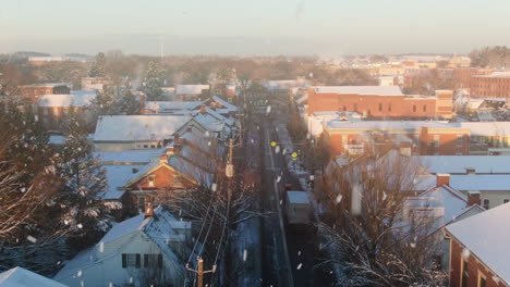 AERIAL-Over-Rooftops-Of-Downtown-Lititz,-Pennsylvania-USA-During-Snowstorm