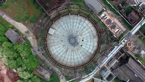 Aerial-top-down-view-of-storage-tank-at-abandoned-steel-factory