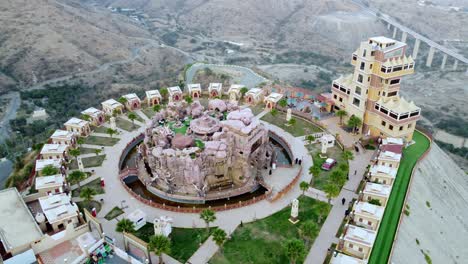 Aerial-view-around-the-Al-Khulb-Park-and-Restaurant,-in-Saudi-Arabia---orbit,-drone-shot