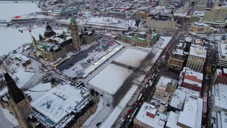 Drone-shot-of-Freedom-Trucker-Rally-on-Slater-Street-in-Ottawa,-Ontario-on-January-30,-2022-during-the-COVID-19-pandemic
