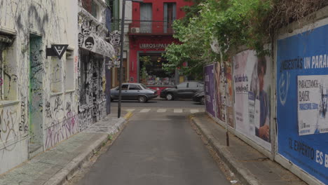 Scene-with-graffiti-and-advertisements-on-walls,-Buenos-Aires