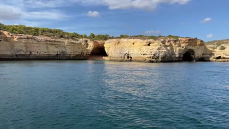 Sea-caves-along-the-coast-line-of-Portugal,-view-from-boat-at-sea