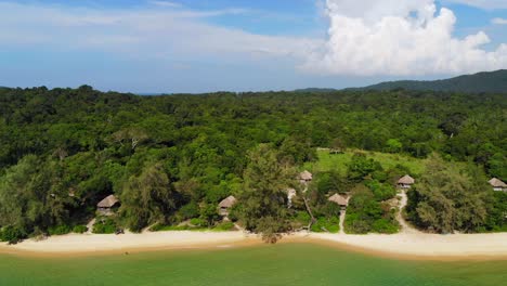 Houses-or-huts-on-Koh-Rong-beach,-Cambodia,-cheap-accomodation-for-tourist,-drone-aerial-view