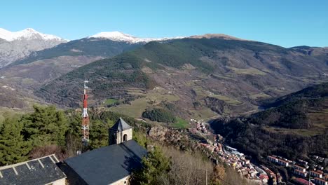 Drone-shot-flying-over-Sant-Antoni-church-in-Ribes-de-Freser,-Pyrenees-Mountains