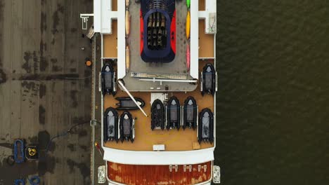 Aerial-Top-down-view-moving-stern-to-bow-of-cruise-vessel-Hanseatic-Spirit-while-alongside-at-Port-of-Turku