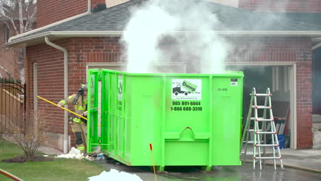 Smoke-smoldering-from-a-dumpster-after-firefighters-put-out-a-fire
