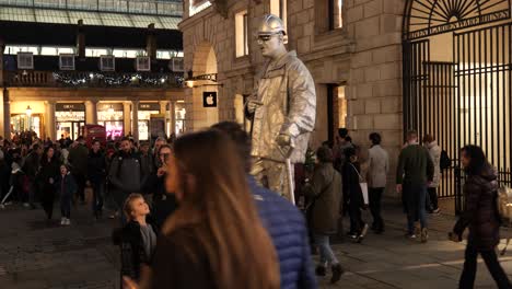 Talented-funny-silver-street-performer-levitation-trick-city-life-attraction-at-Covent-garden