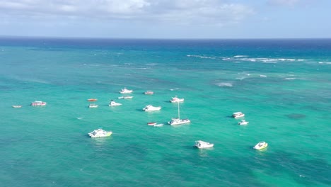 Sailing-On-Turquoise-Water-Of-Atlantic-Ocean-At-Los-Corales-Beach-Bavaro-In-Punta-Cana,-Dominican-Republic