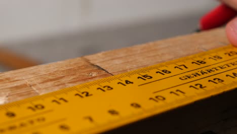Manual-ruler-wood-markings-for-nail-alignment