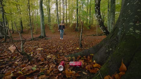 Young-Man-Spots-Soda-Cans-Laying-in-Nature-and-Picks-Them-Up-Dissatisfied-of-Societys-Litter,-Gyllebo,-Skåne,-Sweden---Static-Wide-Shot