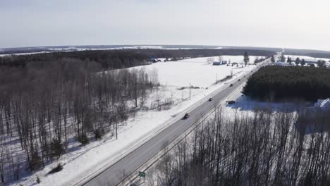 Aerial-footage-of-freedom-convoy-supporters-driving-down-hwy-138-from-Cornwall-on-cold-sunny-day-in-canada