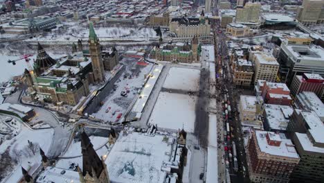 Drone-shot-of-Freedom-Trucker-Rally-on-Slater-Street-in-Ottawa,-ON-on-January-30,-2022-during-the-COVID-19-pandemic