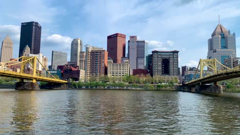 Pittsburgh-Skyline-with-two-famous-Andy-Warhol-and-Roberto-Clemente-Bridge-seen-from-Allegheny-river-Warerfront