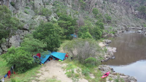 Riverside-rafting-campsite-in-deep-rugged-Deddick-Valley-canyon,-AUS