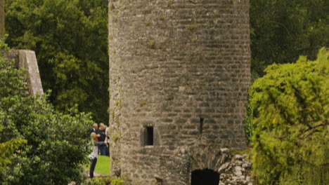 Tilt-down-Through-Lookout-Tower-With-Wooden-Bridge-Under-River-At-Blarney-Castle-In-Ireland