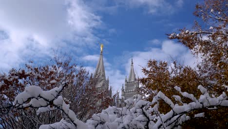 The-LDS-Mormon-Temple-in-Salt-Lake-City,-Utah-after-a-snow-storm-on-a-clear-morning---panning-left