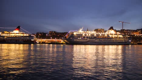 Cruise-Ships-Docked-At-Stadsgarden-Tegelvikshamn-At-Night-In-Stockholm,-Sweden