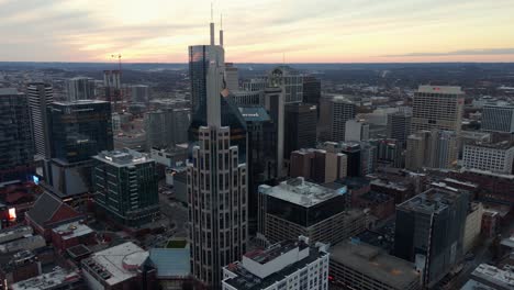 Aerial-view-around-skyscrapers,-dusk-in-downtown-Nashville---orbit,-drone-shot