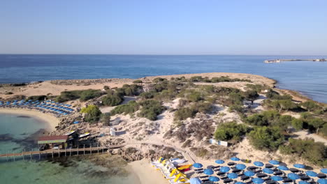 Aerial-shot-of-the-seashore-and-the-beach-at-a-holiday-resort