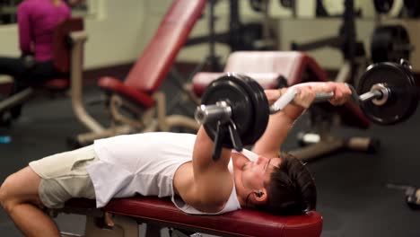 Closeup-of-young-bodybuilder-doing-lying-triceps-press-exercises