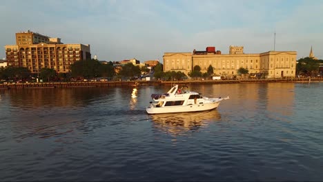 Tracking-a-boat-on-the-Cape-Fear-River-close-to-downtown-Wilmington-NC-and-the-battleship-at-sunset