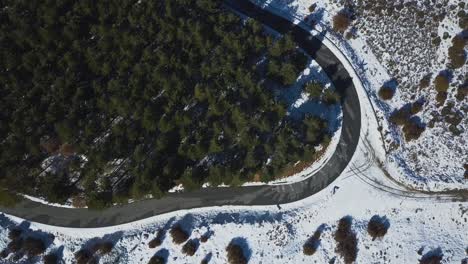 Aerial-view-of-a-road-in-the-snowed-moutains
