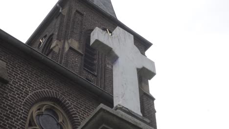 Footage-of-a-cross-in-front-of-a-church-in-germany