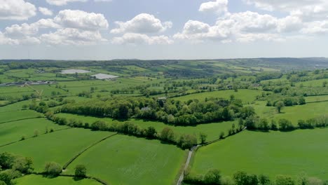 Aerial-tracking-over-quaint-countryside-green-English-Fields