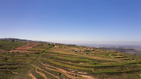 Aerial-view-of-green-Golan-terrace-hills,-Israel