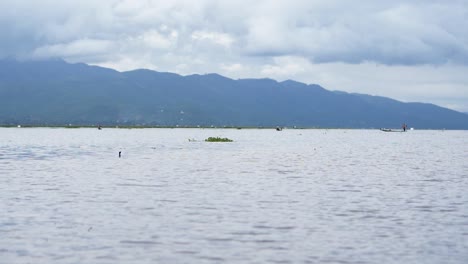 Boating-across-Inle-Lake,-Myanmar-in-cloudy-conditions