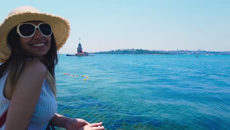 Beautiful-girl-takes-pictures-of-Bosphorus,a-popular-destination-in-Uskudar-town,Istanbul,Turkey