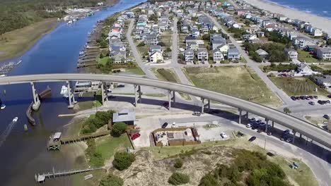Drone-flyover-in-Holden-Beach-NC-on-a-bright,-sunny-day-in-Southeastern-NC-near-the-intracoastal-waterway
