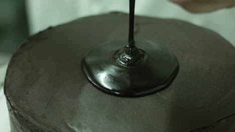 Pouring-Chocolate-Syrup-On-A-Chocolate-Cake