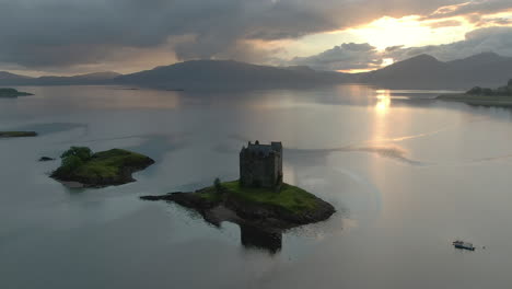 An-aerial-view-of-Castle-Stalker-on-Loch-Laich-as-the-sun-begins-to-set