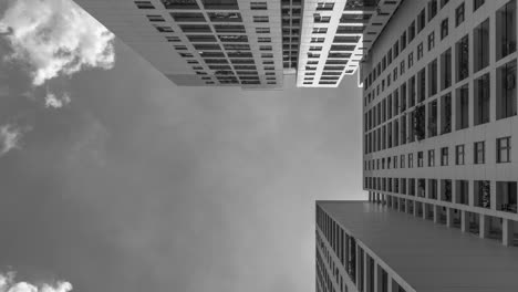 4k-Black-and-White-Time-Lapse-from-low-angle-looking-up-to-architecture-and-dramatic-clouds-moving-left-to-right-through-the-scene