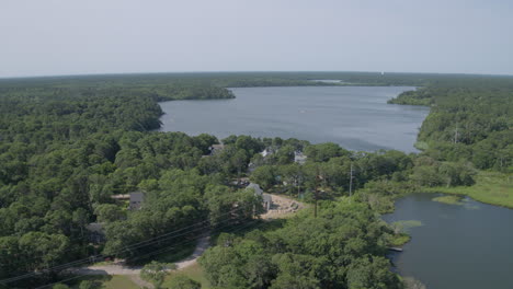 Aerial-flyover-vacation-houses-and-a-pond-in-Cape-Cod-Massachusetts