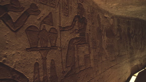 Close-shot-of-some-hieroglyphs-in-a-wall-of-the-Abu-Simbel-temple-in-Egypt