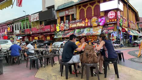 Footage-of-Ipoh-town-restaurant-with-an-open-air-dining-settings-as-well-as-people-eating-along-the-side-road