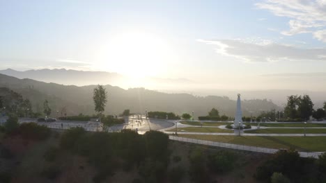 Beautiful-aerial-sunrise-of-Griffith-Observatory---Pan-left-to-right