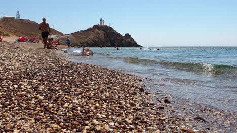 Tourists-on-the-beach-of-Cala-del-Corralete,-Cabo-de-Gata