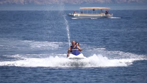 Father-and-son-enjoying-the-ride-on-the-jetski